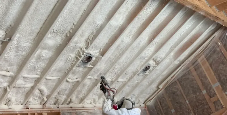applying spray foam insulation
